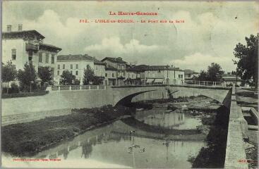 1 vue La Haute-Garonne. 392. L'Isle-en-Dodon : le pont sur la Save / Jansou. - Toulouse : Labouche frères, marque LF au verso, [vers 1905]. - Carte postale
